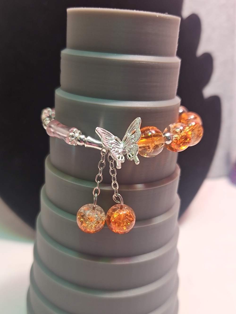 Silver Butterfly Charm Bracelet with Orange Crackle Beads